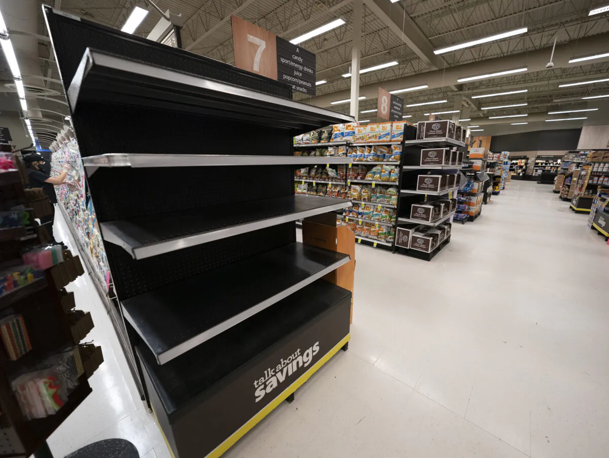 An empty shelf of a grocery store is seen in Chilliwack, B.C., November 19, 2021. (The Canadian Press/Jonathan Hayward)