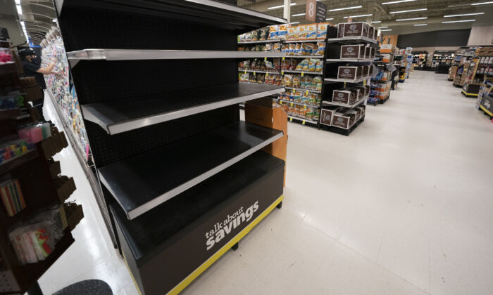 An empty shelf of a grocery store is seen in Chilliwack, B.C., November 19, 2021. (The Canadian Press/Jonathan Hayward)