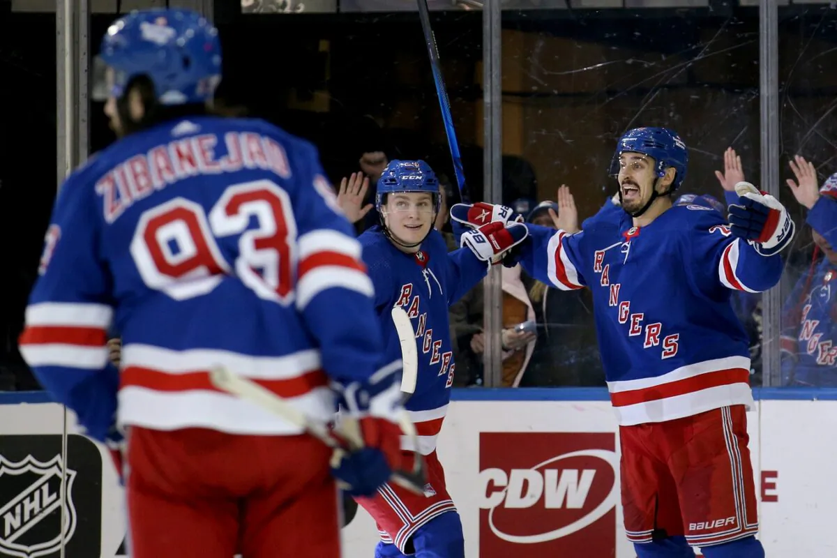 New York Rangers left wing Chris Kreider (20) celebrates his goal against the Toronto Maple Leafs with right wing Kaapo Kakko (24) and center Mika Zibanejad (93) during the third period at Madison Square Garden in N.Y., on Jan. 19, 2022. (Brad Penner/USA TODAY Sports via Field Level Media)