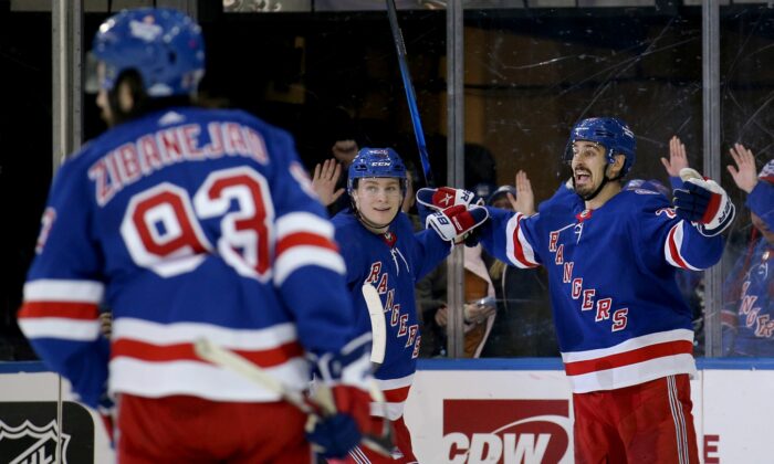New York Rangers left wing Chris Kreider (20) celebrates his goal against the Toronto Maple Leafs with right wing Kaapo Kakko (24) and center Mika Zibanejad (93) during the third period at Madison Square Garden in N.Y., on Jan. 19, 2022. (Brad Penner/USA TODAY Sports via Field Level Media)