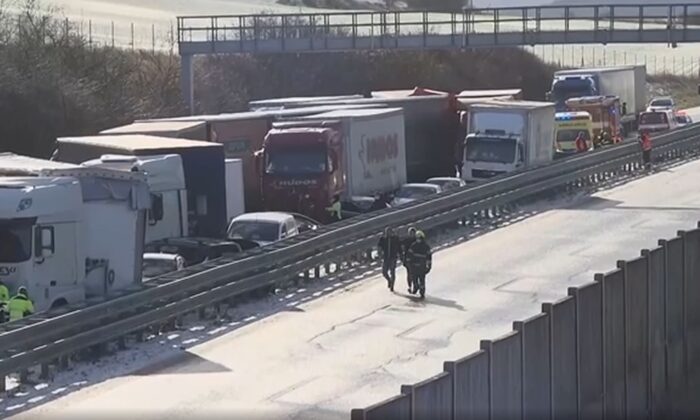 Trucks and cars involved in a multi-car crash on highway D5 near Zebrak in Beroun Region, Czech Republic, on Jan. 20, 2022. (AP/Screenshot via The Epoch Times)
