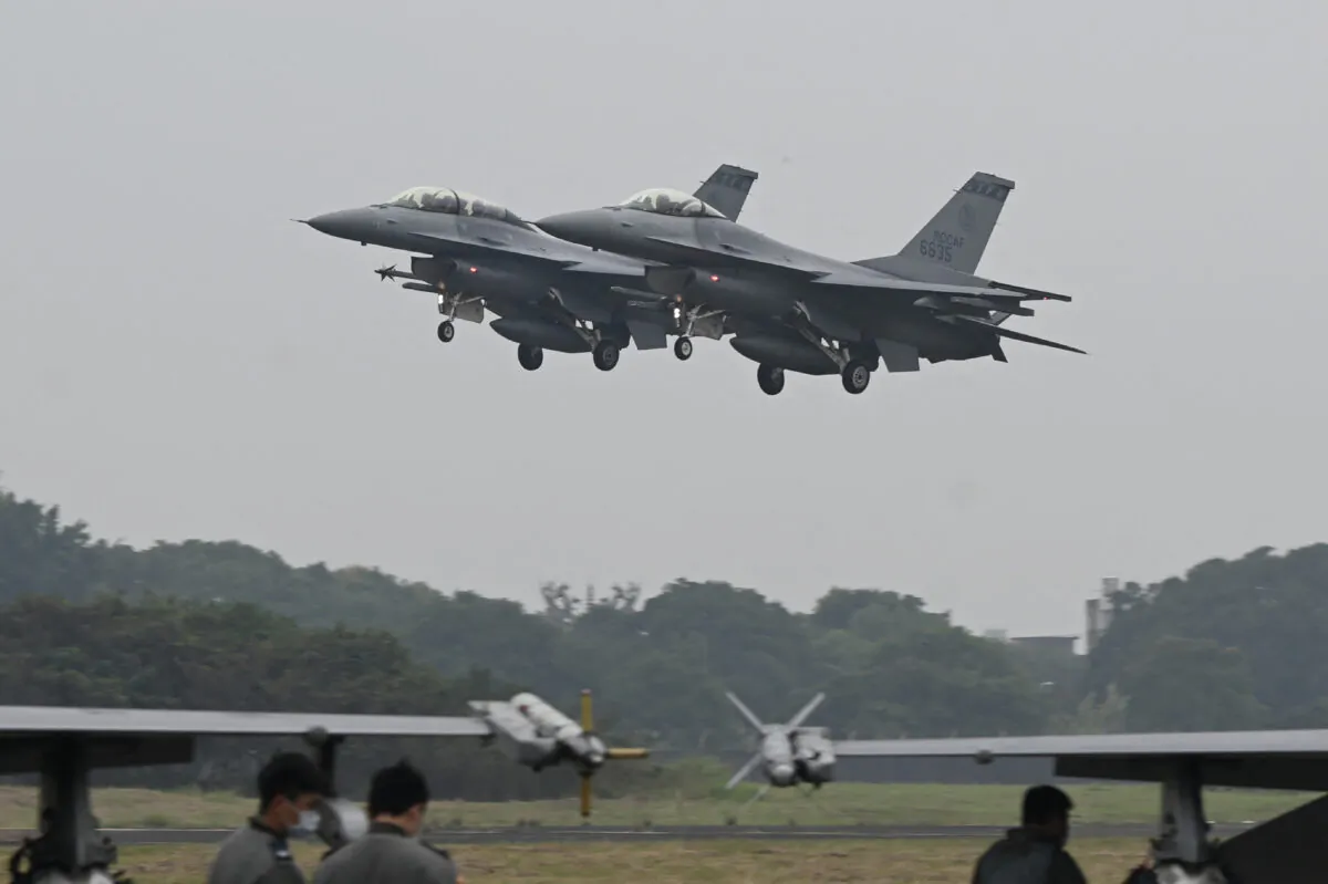 Two armed US-made F-16V fighters fly over at an air force base in Chiayi, southern Taiwan on Jan. 5, 2022. (Sam Yeh/AFP via Getty Images)