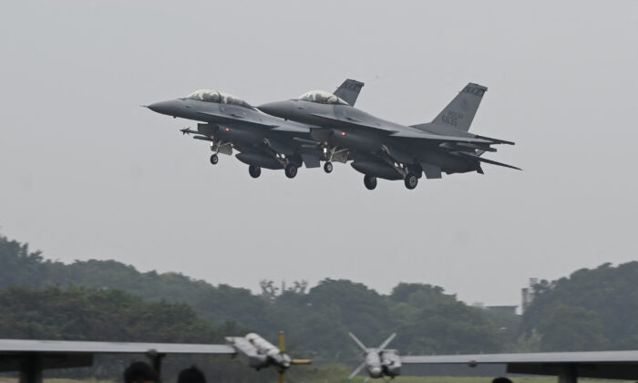 Two armed US-made F-16V fighters fly over at an air force base in Chiayi, southern Taiwan on Jan. 5, 2022. (Photo by Sam Yeh / AFP) (Photo by SAM YEH/AFP via Getty Images)