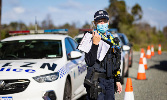 WA Police inspect cars at a Border Check Point on Indian Ocean Drive north of Perth, Australia on Jun. 29, 2021. (Matt Jelonek/Getty Images)