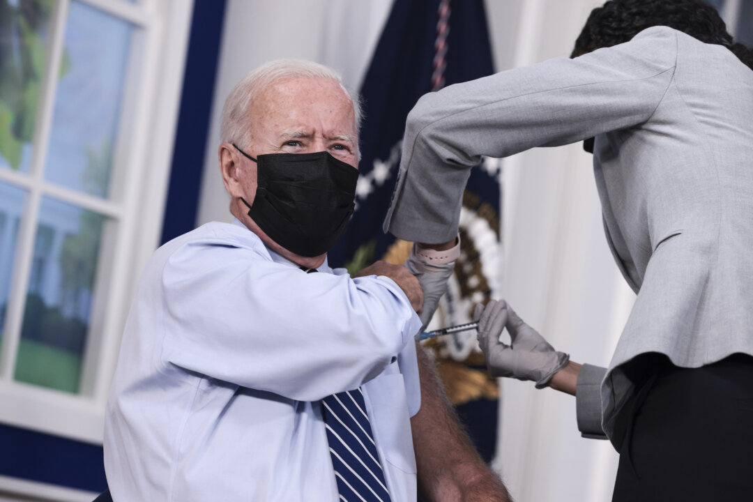 President Joe Biden receives a third dose of the Pfizer/BioNTech COVID-19 vaccine in the South Court Auditorium in the White House on Sept. 27, 2021. (Anna Moneymaker/Getty Images)