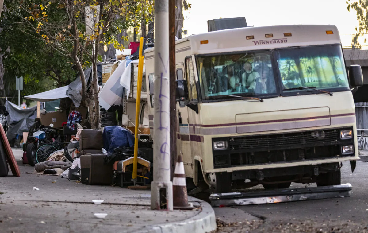 Homeless individuals live in RVs in Los Angeles, on Jan. 20, 2022. (John Fredricks/The Epoch Times)