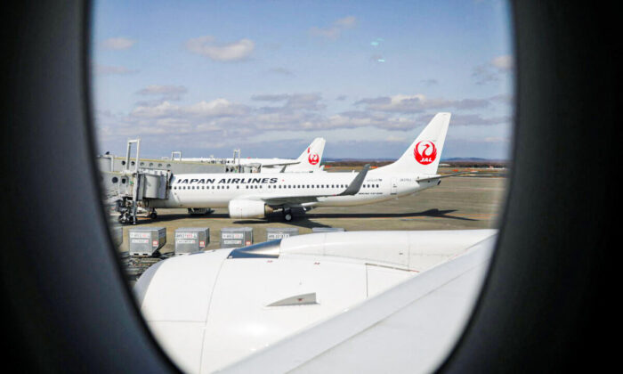 Japan Airlines (JAL) planes sit on the tarmac at New Chitose Airport, in Sapporo, Hokkaido, Japan, on May 4, 2021. (Issei Kato/Reuters)
