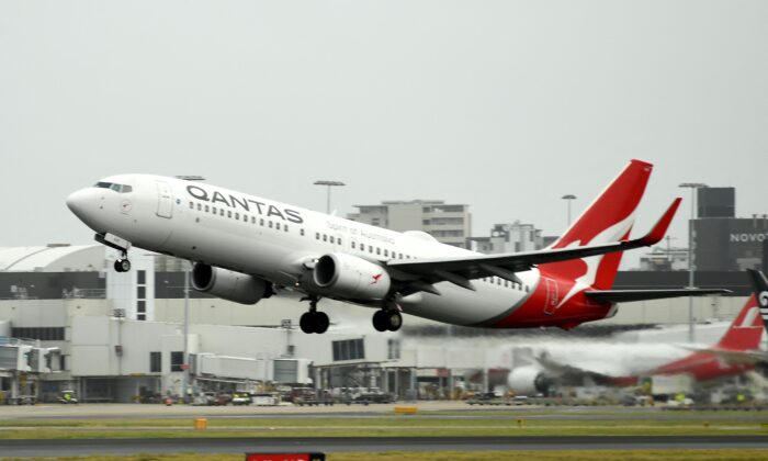 A Qantas plane takes off from the Sydney International airport in Sydney, on May 6, 2021. (Saeed Khan/AFP via Getty Images)