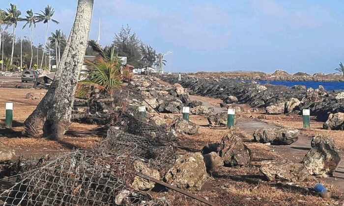 This photo provided by Broadcom Broadcasting shows a damaged area in Nuku’alofa, Tonga, on Jan. 20, 2022. (Marian Kupu/Broadcom Broadcasting via AP)