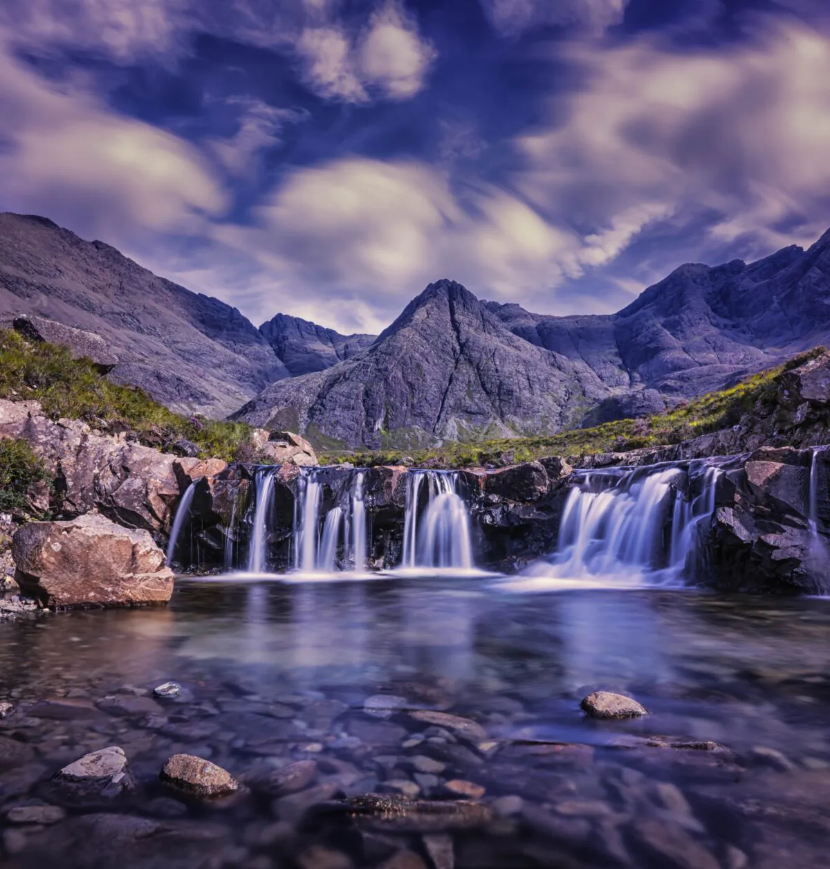 Purple Waterfall in the United Kingdom. Photo by Robert Lukeman via Unsplash.