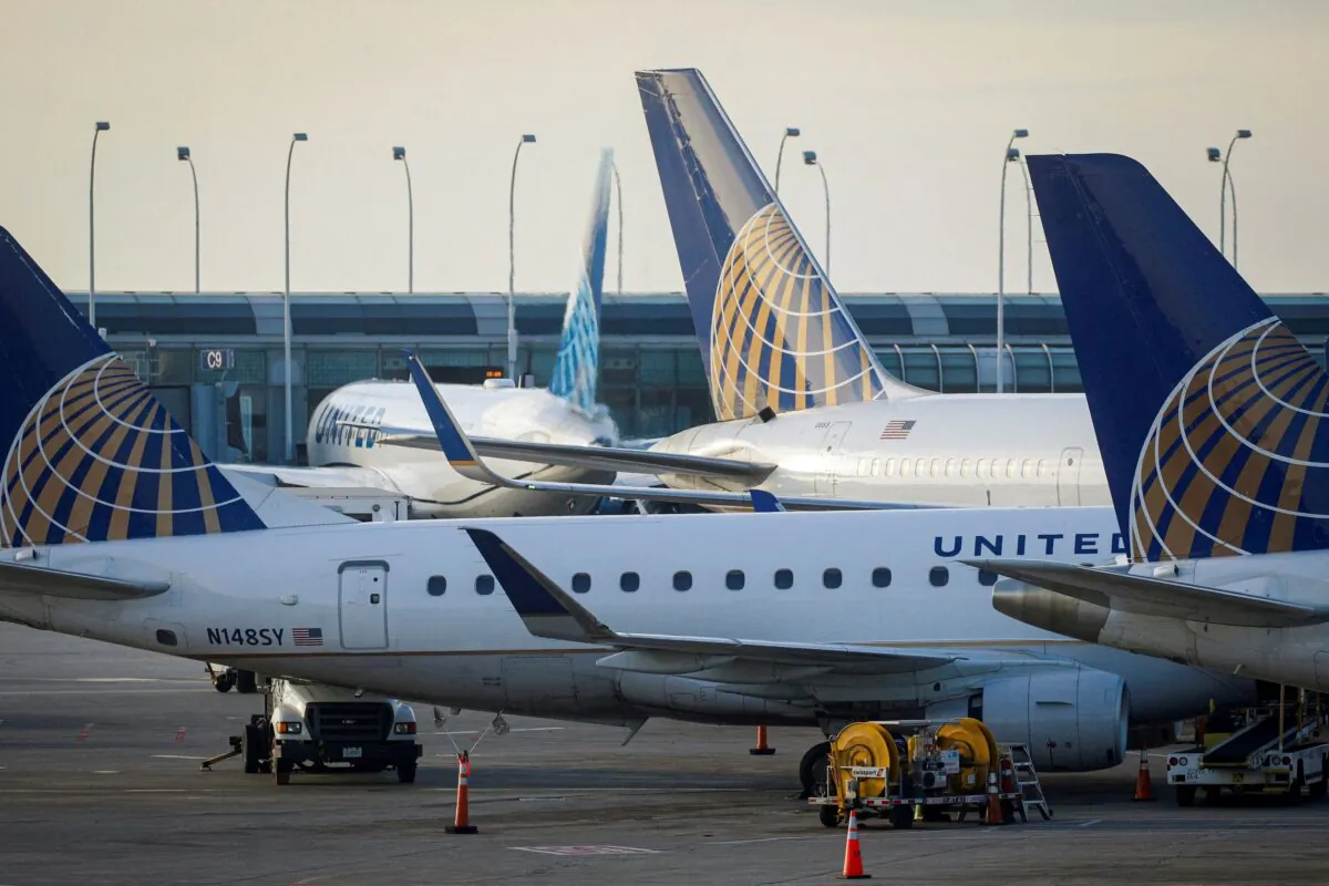 United Airlines planes are parked at their gates at O'Hare International Airport ahead of the Thanksgiving holiday in Chicago, Ill., on Nov. 20, 2021. (Brendan McDermid/Reuters)