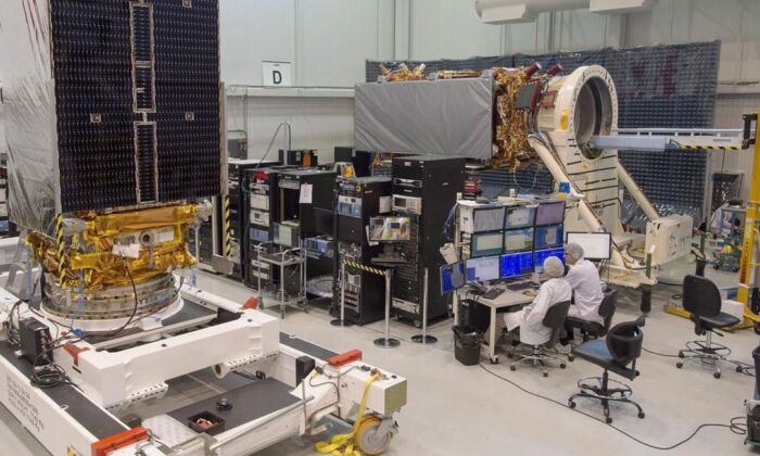 Technicians finished two of the three Radarsat Constellation Mission satellites at the MDA facility in Montreal on June 21, 2018.  (Canadian Press / Ryan Remiorz)