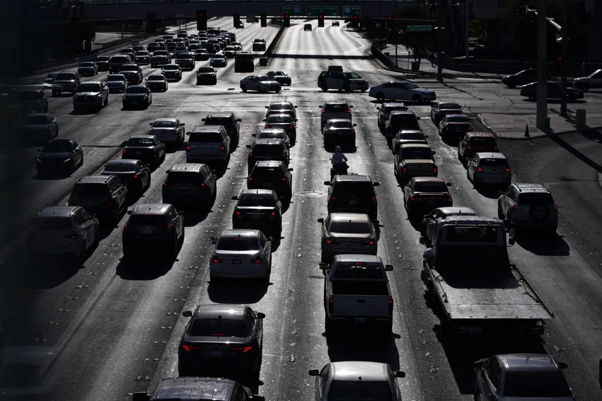 Cars wait at a red light during rush hour at the Las Vegas Strip in Las Vegas on April 22, 2021. (John Locher/AP Photo)