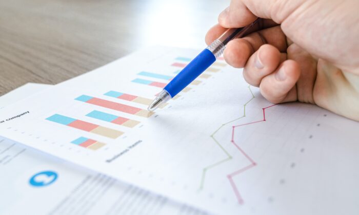 Stock photo of data charts on paper. (Lukas/Pexels)