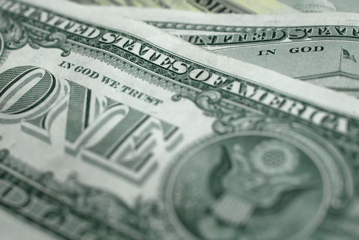 The words "In God We Trust" are seen on U.S. dollar banknotes in Wash., on Oct. 14, 2004. (Alex Wong/Getty Images)