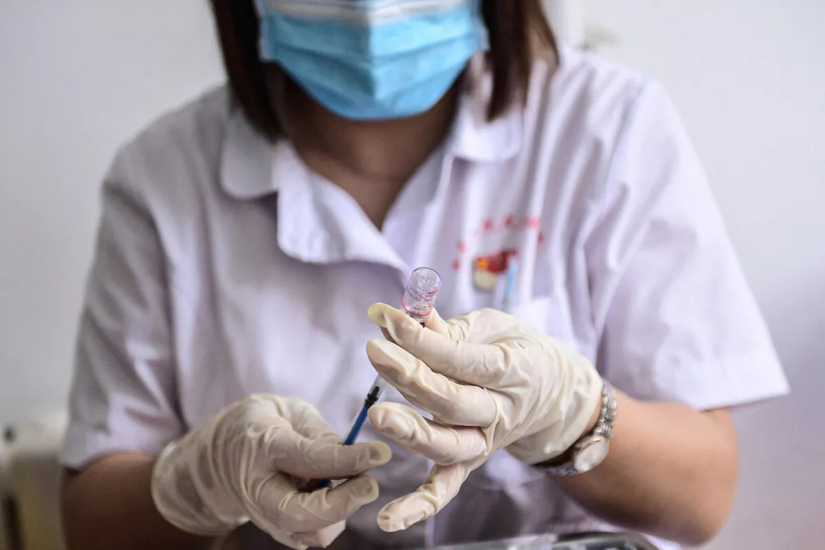 A medical staff member prepares a dose of the Sinovac COVID-19 vaccine in Shenyang, in China's northeastern Liaoning Province, on Aug. 1, 2021. (STR/AFP via Getty Images)