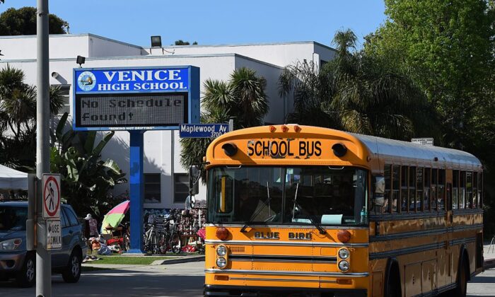 A school bus is parked outside the Venice High School in Venice Beach, Calif., on March 14, 2015. (Mark Ralston/AFP via Getty Images)