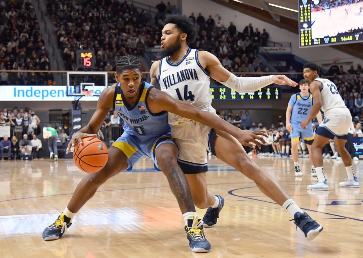 Marquette Golden Eagles forward Justin Lewis (10) is defended by Villanova Wildcats guard Caleb Daniels (14), during the second half at William B. Finneran Pavilion in Villanova, Pa., on Jan. 19, 2022. (Eric Hartline/USA TODAY Sports via Field Level Media)