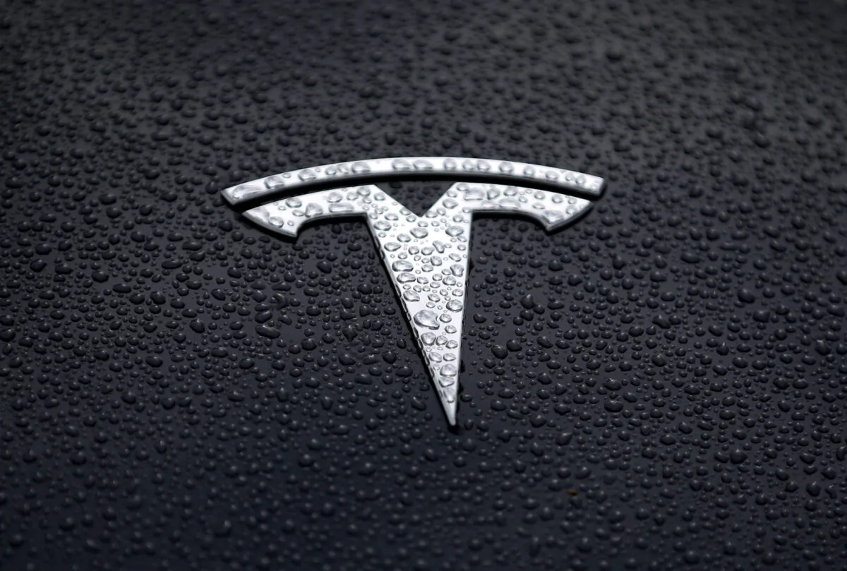 The Tesla logo is displayed on the hood of a Tesla car in Corte Madera, Calif., on May 20, 2019. (Justin Sullivan/Getty Images)