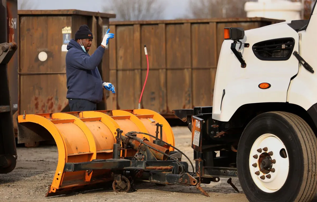 Public Works crews prepare for snow from an impending winter storm at Virginia Beach, Va., on Jan. 20, 2022. (Stephen M. Katz/The Virginian-Pilot via AP)
