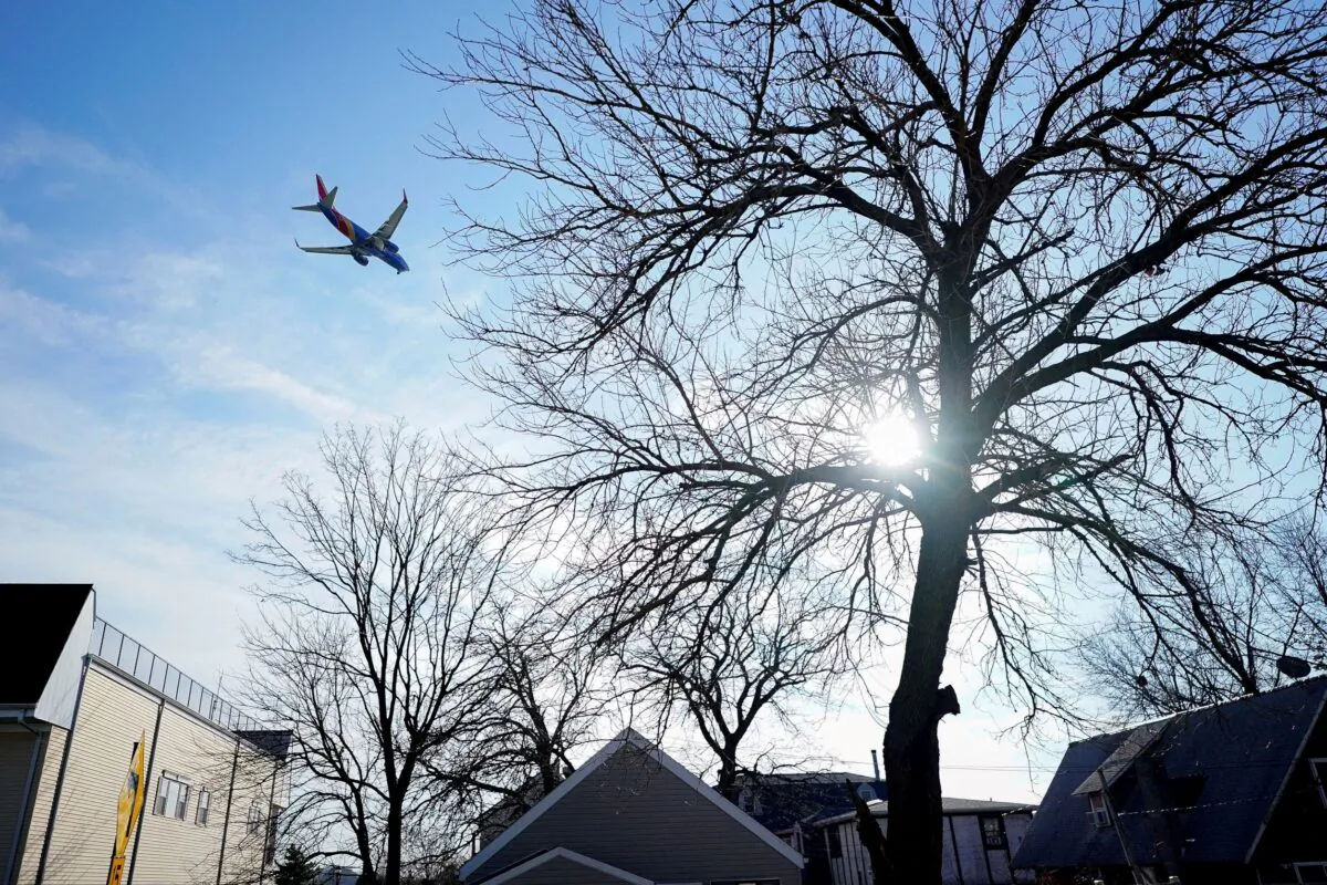 A Southwest Airlines flight, equipped with radar altimeters that may conflict with telecom 5G technology, flies 500 feet above the ground while on final approach to land at LaGuardia Airport in New York City, N.Y., on Jan. 6, 2022. (Bryan Woolston/Reuters)
