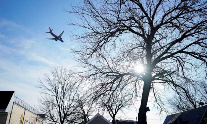 A Southwest Airlines flight, equipped with radar altimeters that may conflict with telecom 5G technology, flies 500 feet above the ground while on final approach to land at LaGuardia Airport in New York City, N.Y., on Jan. 6, 2022. (Bryan Woolston/Reuters)