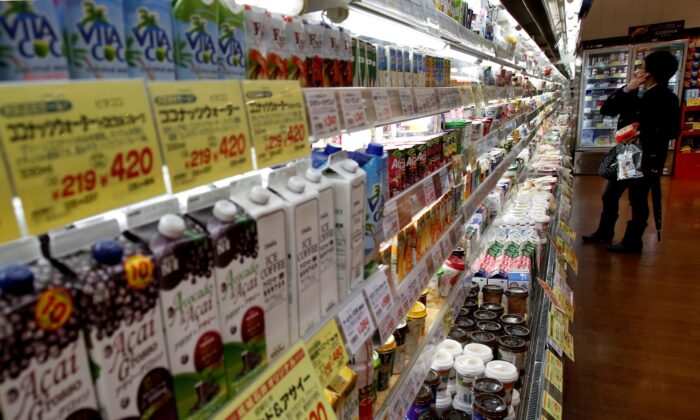 A shopper looks at items at a supermarket in Tokyo, on Feb. 26, 2015. (Yuya Shino/Reuters)
