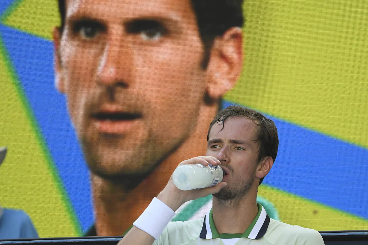 Daniil Medvedev of Russia takes a drink during a break in his third round match against Botic van de Zandschulp of the Netherlands at the Australian Open tennis championships in Melbourne, on Jan. 22, 2022. (Andy Brownbill/AP Photo)