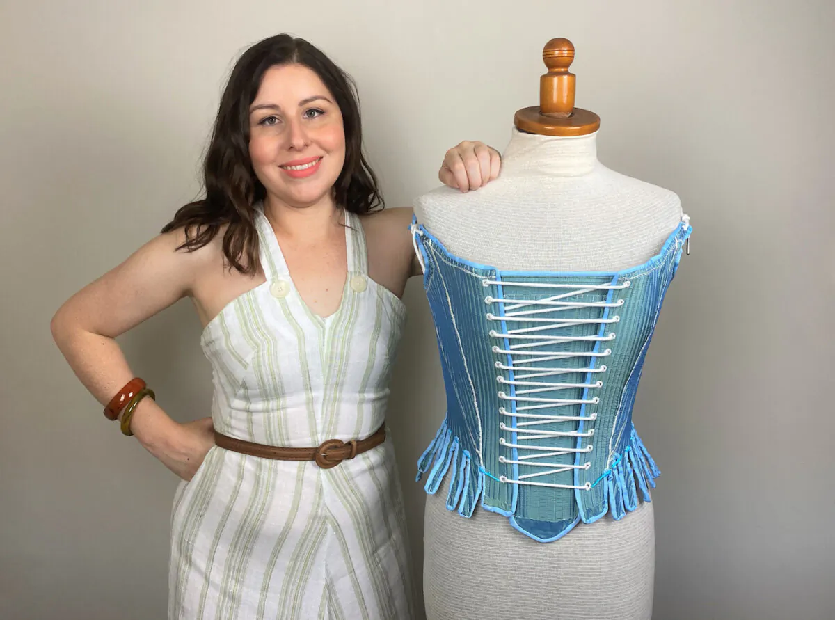 Material culture historian Dr. Sarah Bendall with a reconstructed early modern corset in Melbourne on Jan. 21, 2022. (AAP Image/Supplied by Dr Sarah Bendall)