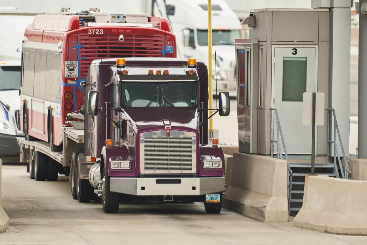 A trucker waits at the Canada Customs booth in Sarnia, Ont., on March 16, 2020. (Geoff Robins/AFP via Getty Images)