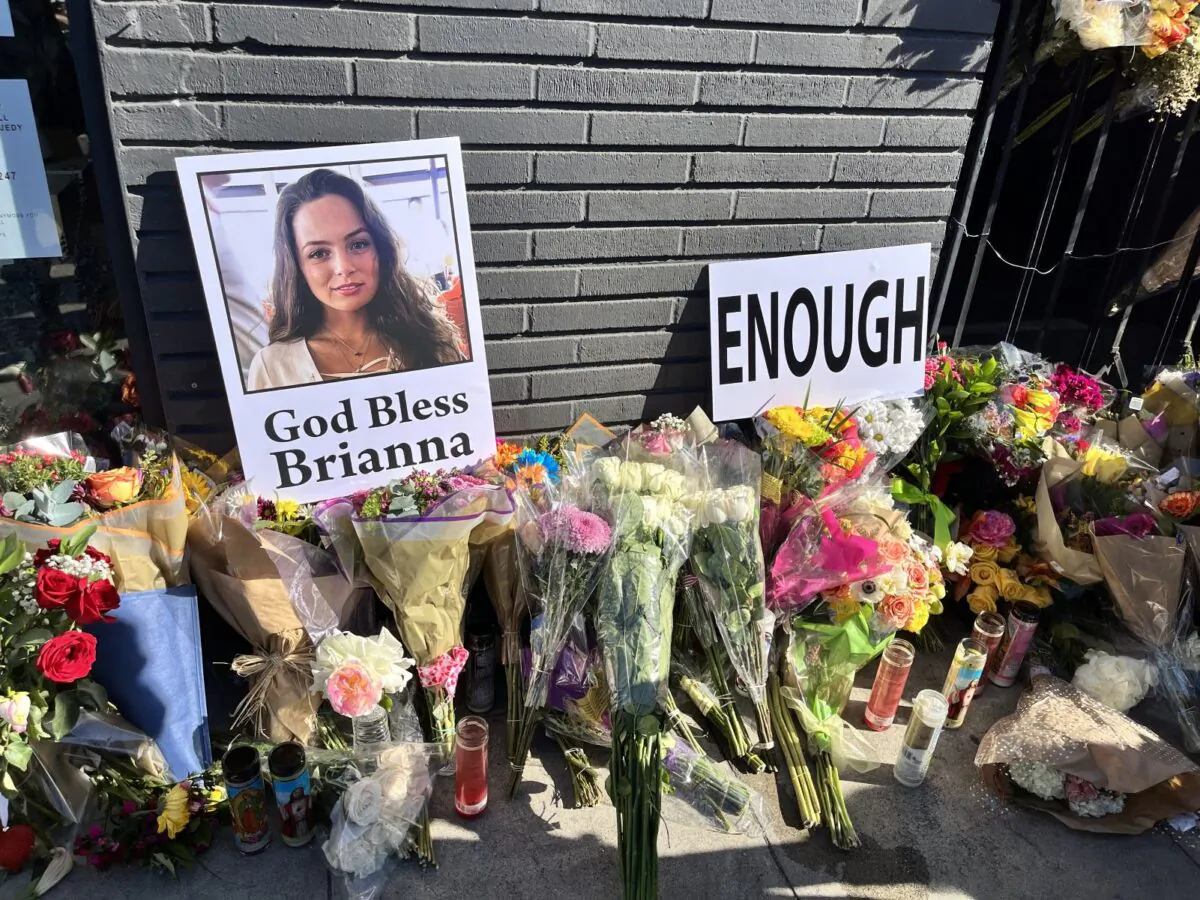 Dozens of friends, co-workers, and Hancock Park residents held a vigil for Brianna Kupfer, a 24-year-old UCLA graduate student, outside of a furniture store in Los Angeles, on Jan. 20, 2022. She was fatally stabbed on Jan. 13, 2022, in the furniture store, where she was working. (The Epoch Times)