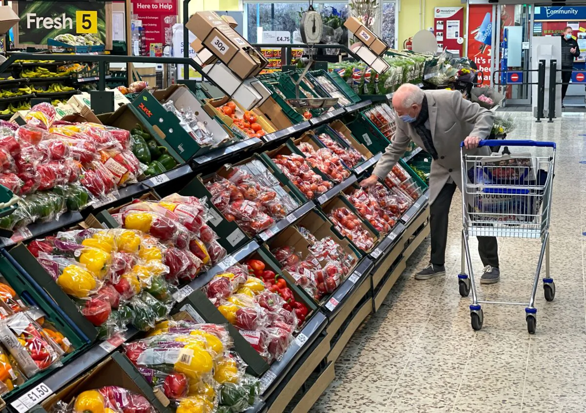 A customer shops for food items inside a Tesco supermarket store in east London, on Jan. 10, 2022. (Daniel Leal/AFP via Getty Images)