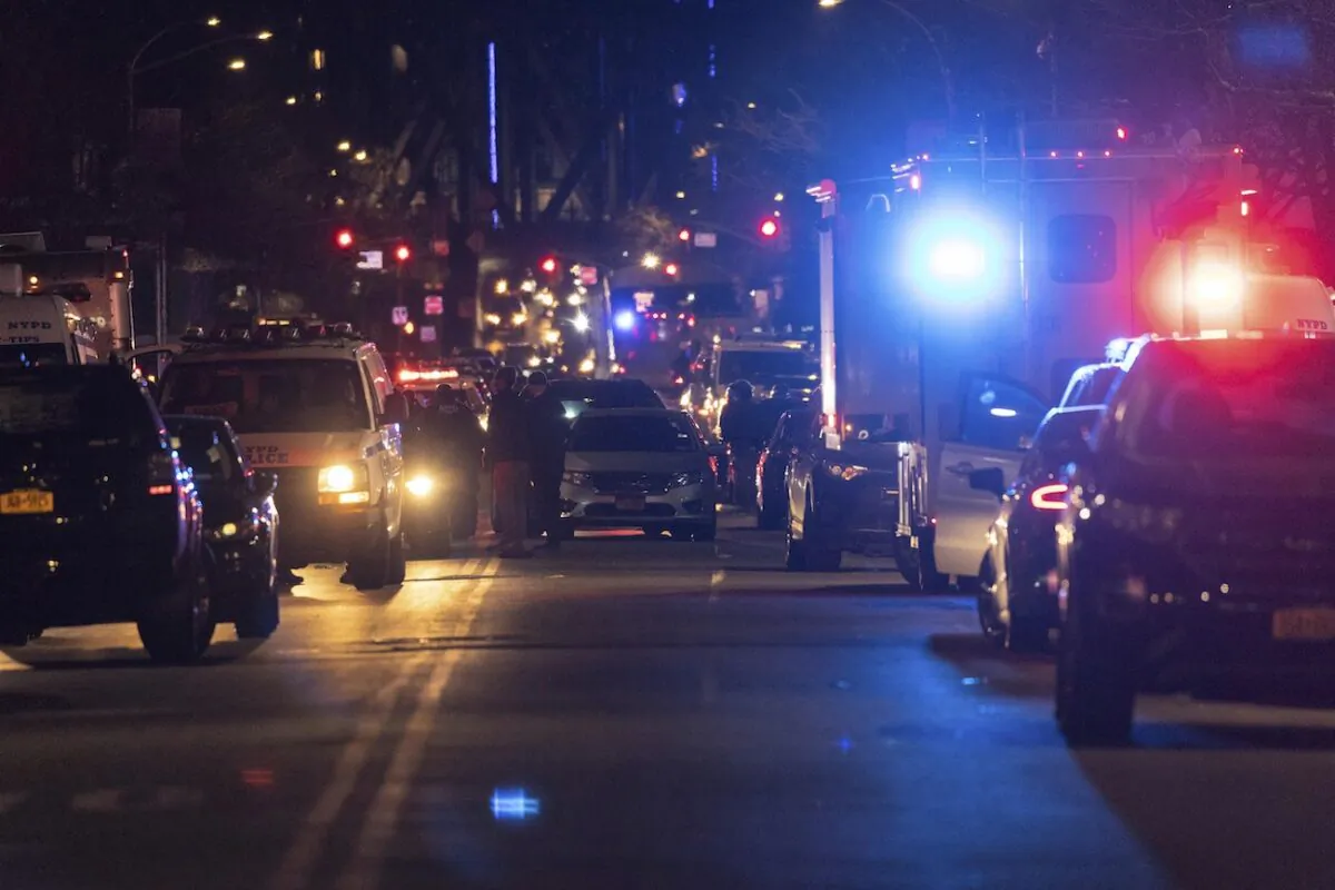 NYPD officers are seen at the scene of shooting in Harlem, N.Y., on Jan. 21, 2022. (Yuki Iwamura/AP Photo)