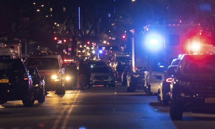 NYPD officers are seen at the scene of shooting in Harlem, N.Y., on Jan. 21, 2022. (Yuki Iwamura/AP Photo)