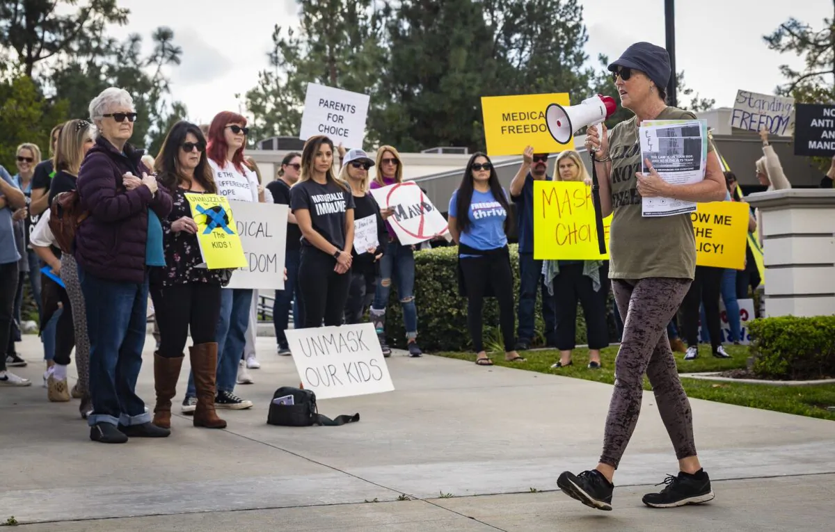 Parents and students gather in protest of school district policies at the Placentia Yorba Linda Unified School District offices in Placentia, Calif., on Jan. 18, 2022. (John Fredricks/The Epoch Times)