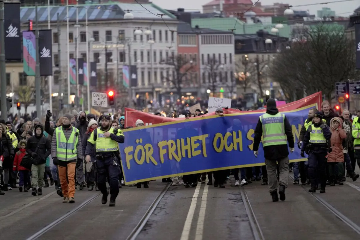 Protestors march as they demonstrate against the COVID-19 measures in Gothenburg, Sweden, on Jan. 22, 2022. (Bjorn Larsson Rosvall/TT News Agency via AP)