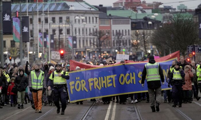 Protestors march as they demonstrate against the COVID-19 measures in Gothenburg, Sweden, on Jan. 22, 2022. (Bjorn Larsson Rosvall/TT News Agency via AP)