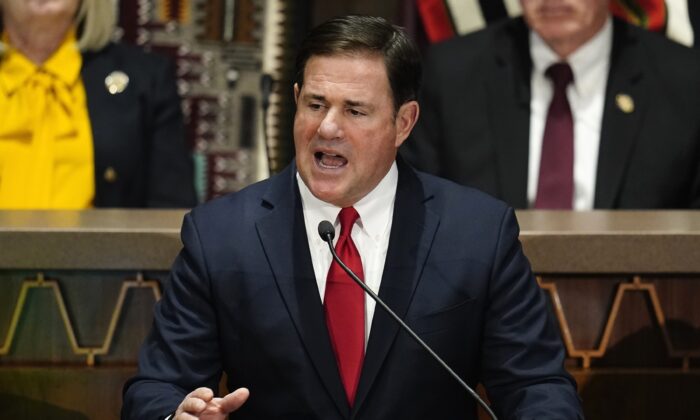 Arizona Republican Gov. Doug Ducey gives his state of the state address at the Arizona Capitol on Monday, Jan. 10, 2022. (Ross D. Franklin/AP Photo).