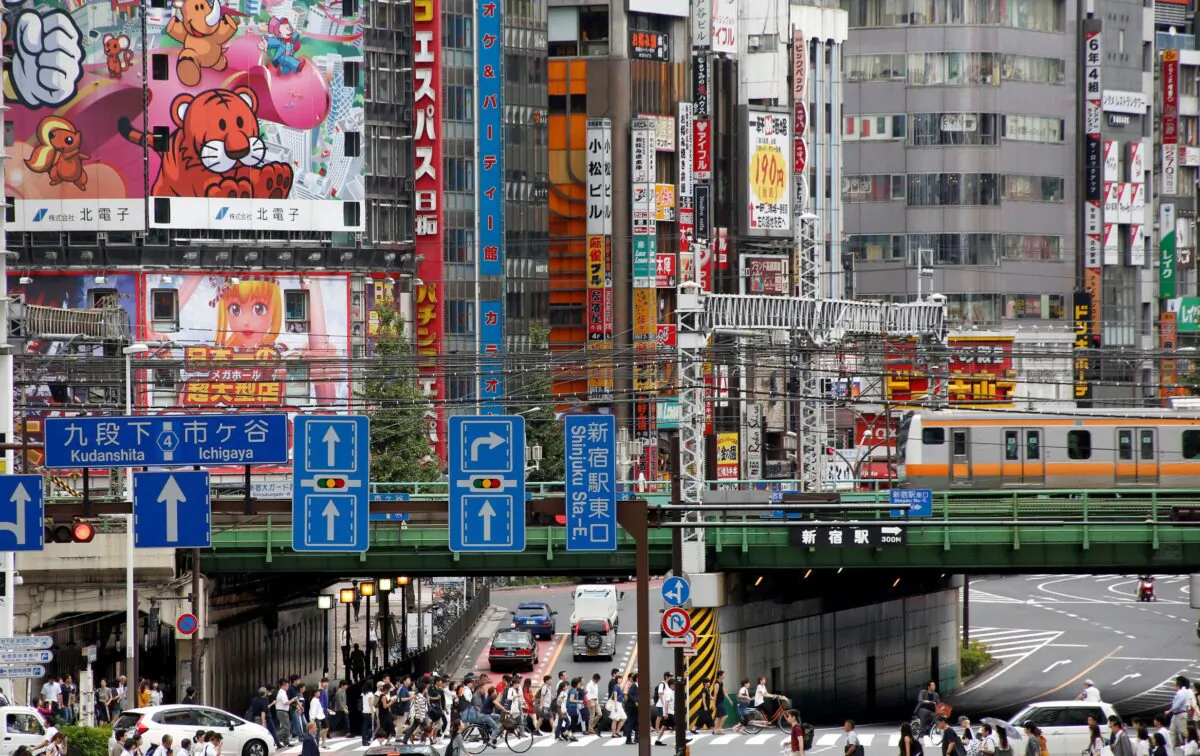 People cross the street at a shopping district in Tokyo, Japan, on Sept. 8, 2016. (Kim Kyung-Hoon/Reuters)