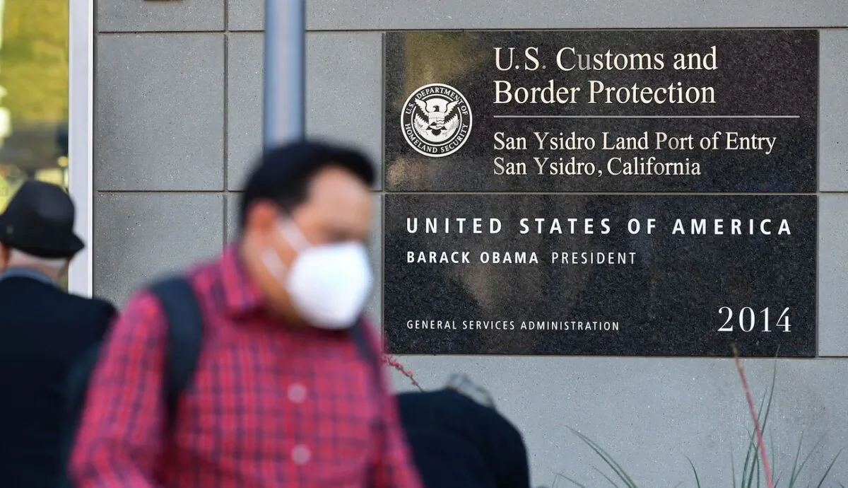 People entering the United States at the San Ysidro Land Port of Entry in San Ysidro, Calif., on Nov. 7, 2021. (Frederic J. Brown/AFP via Getty Images)