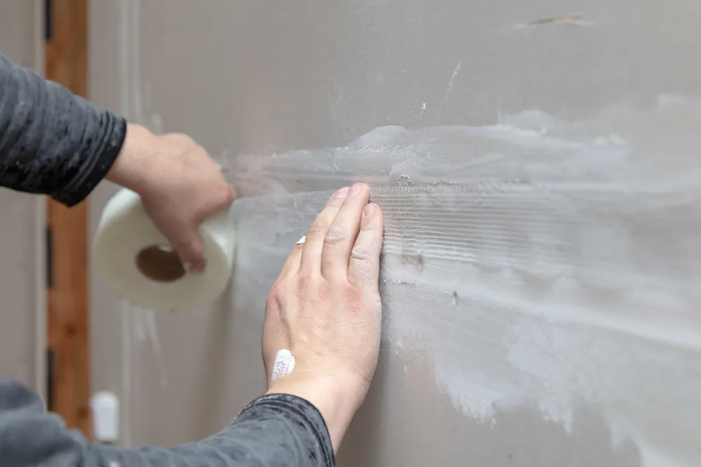 A good method for taping improves the look of every room and saves time. (schankz/Shutterstock)