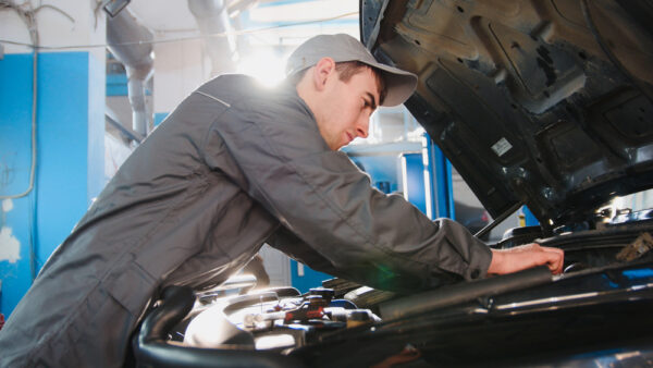 Mechanic,In,Overalls,Working,In,The,Garage,-,Repairing,Luxury
