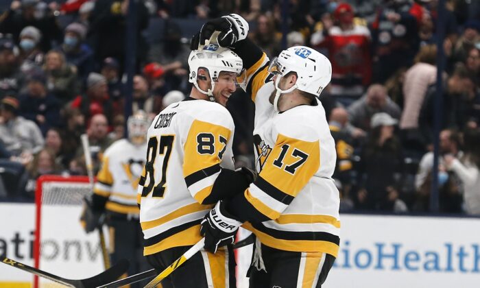Pittsburgh Penguins center Sidney Crosby (87) celebrates his hat trick during the third period against the Columbus Blue Jackets at Nationwide Arena. (Russell LaBounty/USA TODAY Sports via Field Level Media)