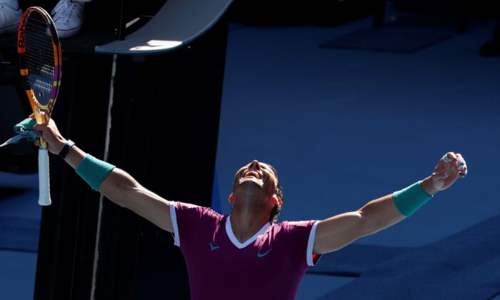 Rafael Nadal of Spain celebrates after defeating Adrian Mannarino of France in their fourth round match at the Australian Open tennis championships in Melbourne, Australia, on Jan. 23, 2022. (Hamish Blair/AP Photo)