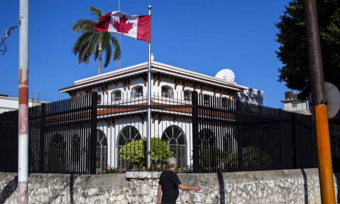 In this April 17, 2018 file photo, a man walks beside Canada's embassy in Havana, Cuba. (AP/Desmond Boylan)