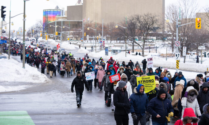 Demonstrators march in protest against COVID-19 mandates and restrictions in Ottawa on Jan. 22, 2022. (The Canadian Press/Michael Chisholm)