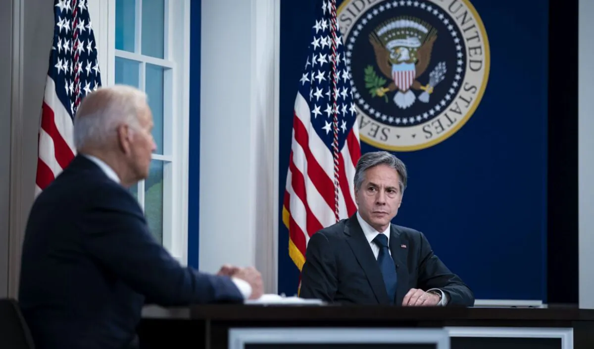 Secretary of State Antony Blinken listens as President Joe Biden speaks during a conference call on Sept. 17, 2021, in Washington. (Photo by Al Drago/Getty Images)