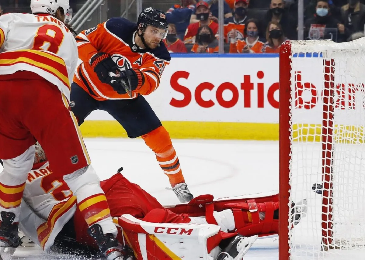 Edmonton Oilers forward Leon Draisaitl (29) scores a third period goal against Calgary Flames goaltender Jacob Markstrom (25) at Rogers Place in Edmonton, Alberta, Canada, on Jan. 22, 2022. (Perry Nelson/USA TODAY Sports via Field Level Media)