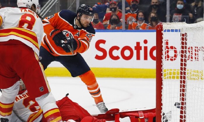 Edmonton Oilers forward Leon Draisaitl (29) scores a third period goal against Calgary Flames goaltender Jacob Markstrom (25) at Rogers Place in Edmonton, Alberta, Canada, on Jan. 22, 2022. (Perry Nelson/USA TODAY Sports via Field Level Media) 