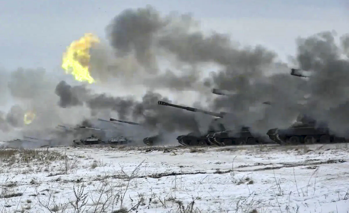 Russian army's self-propelled howitzers fire during military drills near Orenburg in the Urals, Russia, on Dec. 16, 2021. (Russian Defense Ministry Press Service via AP)